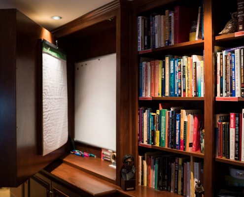 hidden whiteboard in custom cabinetry